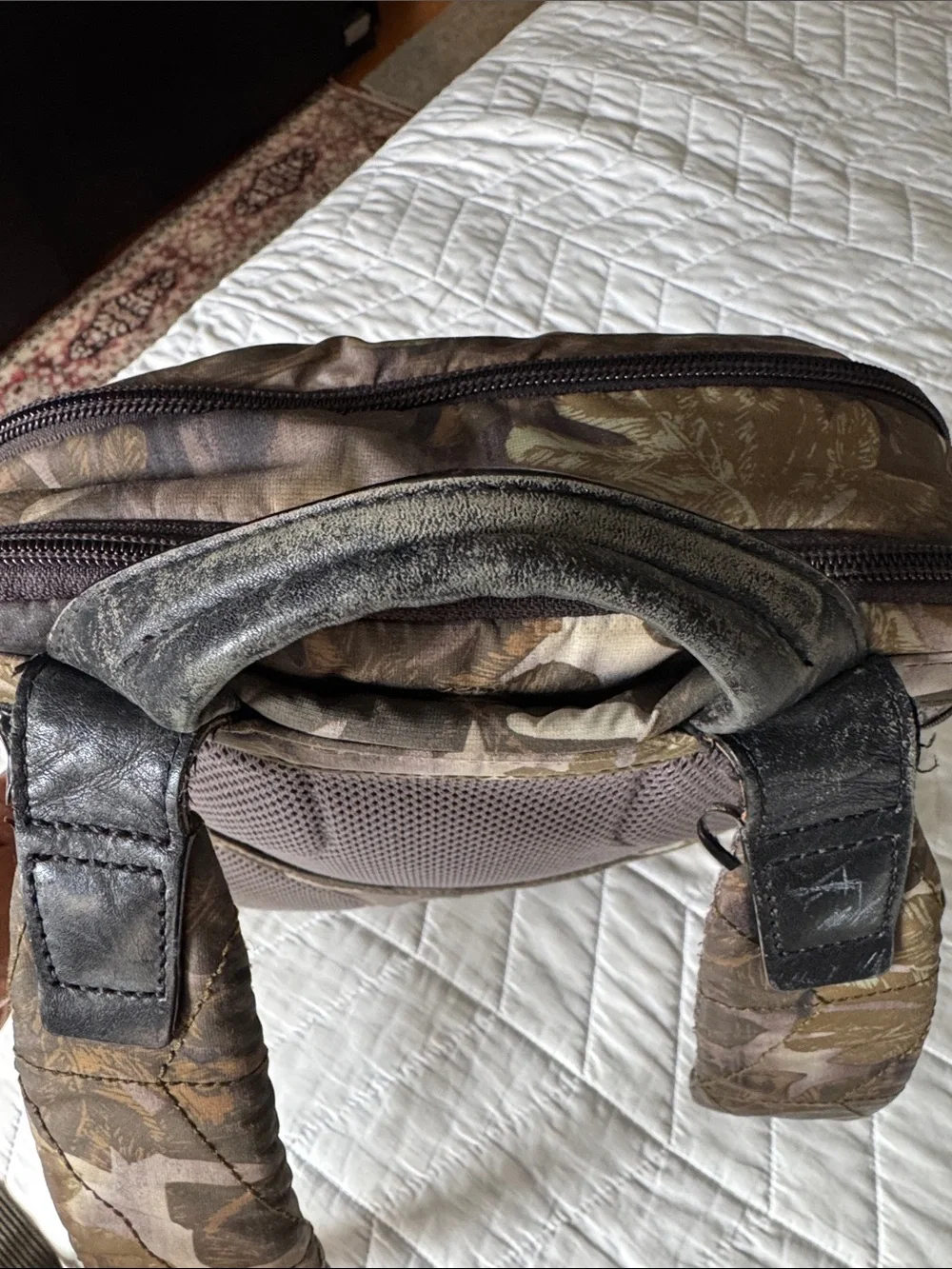 Tumi Black Leather and Brown Leaf-Print Backpack USED